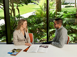Miami Herbert graduate students networking during a campus residency.
